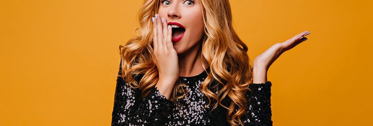 shocked-fair-haired-girl-posing-yellow-wall-with-mouth-open-surprised-glamorous-lady